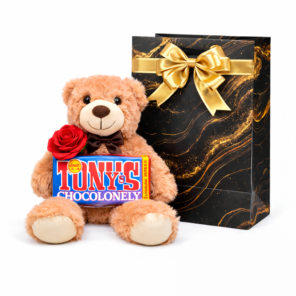 Teddy bear with a Tony's Chocolonely bar and a gift bag on a white background
